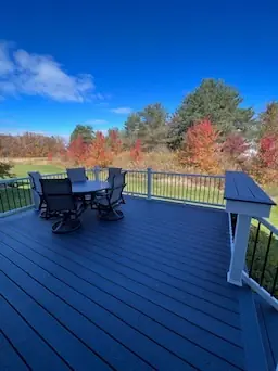 Composite deck with boardwalk and railing overlooking lake by DreamDecks