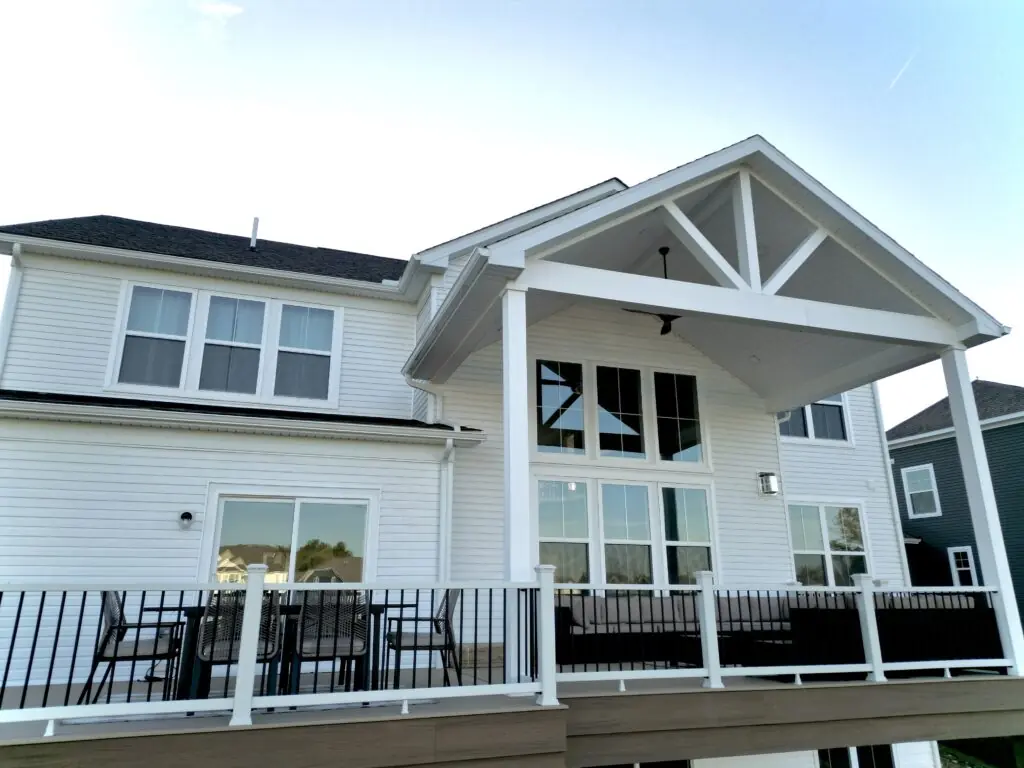 Covered Patios & Roof Structures in Northeast Ohio 5 DreamDecks designs and builds architectural-grade outdoor living spaces across Northeast Ohio. From modern decks to full backyard sanctuaries, each project reflects craftsmanship, precision, and timeless luxury. Call 330-907-3040 or visit buildyourDreamDeck.com DreamDecks | Premier Deck Builder & Outdoor Architecture Spacious covered patio with a modern roof structure overlooking a backyard in Northeast Ohio