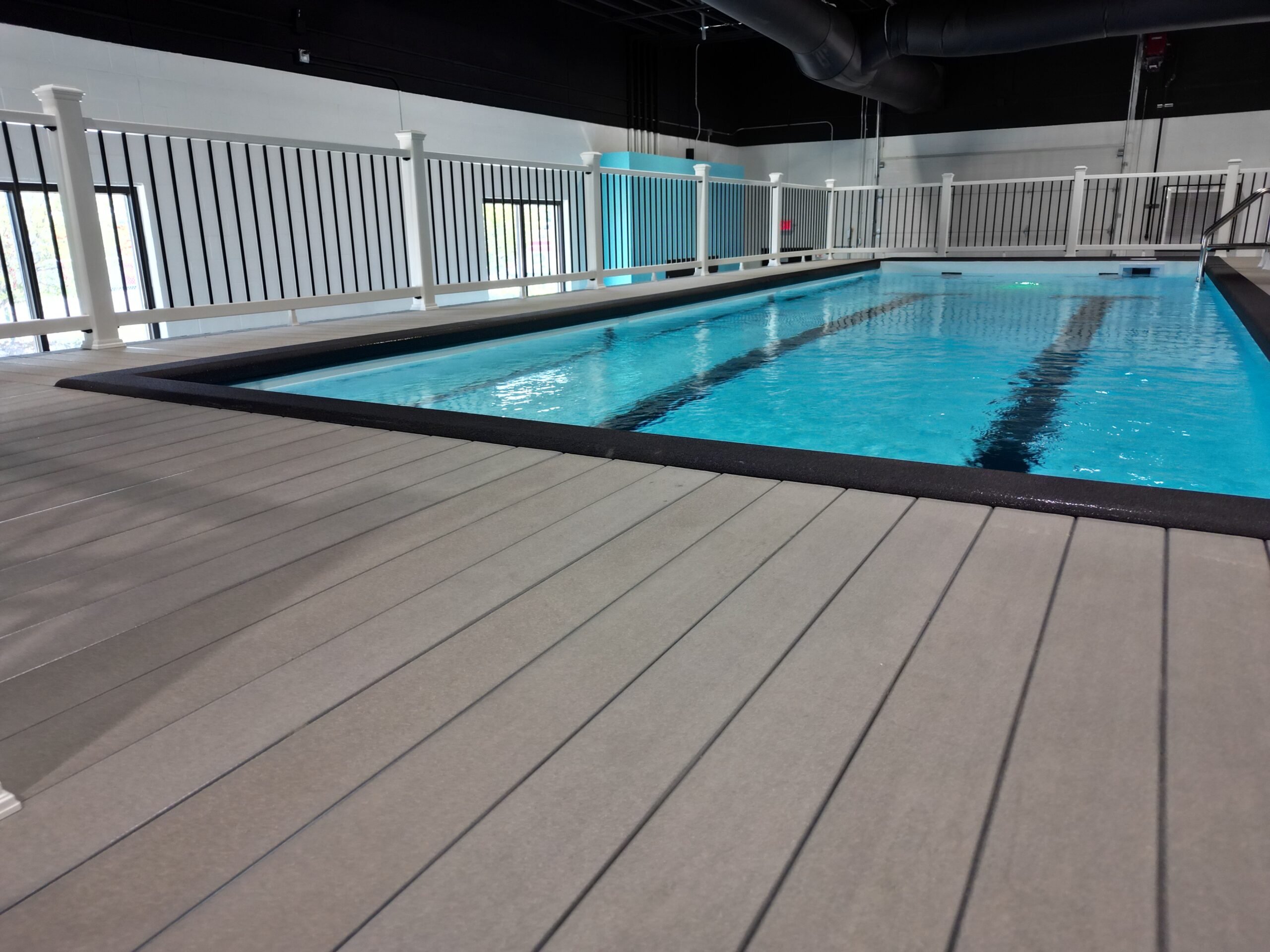 Aerial view of a custom wooden deck with outdoor seating and landscaping in Northeast Ohio