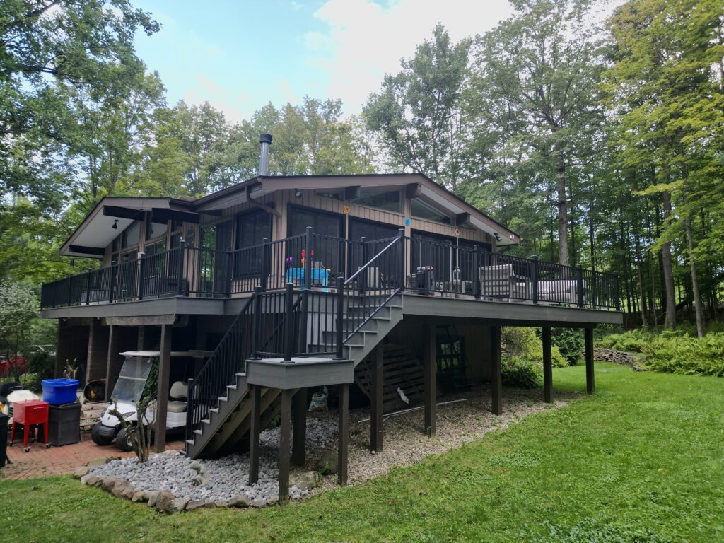 Aerial view of a custom wooden deck with outdoor furniture in Northeast Ohio