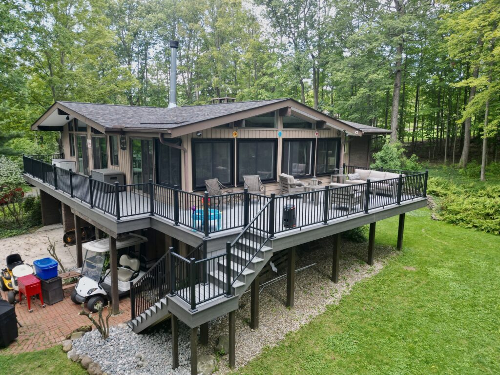 Aerial view of a custom wooden deck with outdoor seating and landscaping in Northeast Ohio