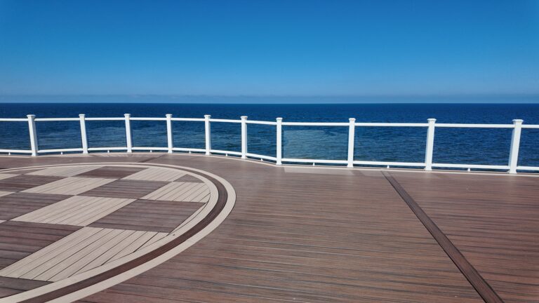 Checkerboard inlay pattern on a lakefront composite deck by DreamDecks