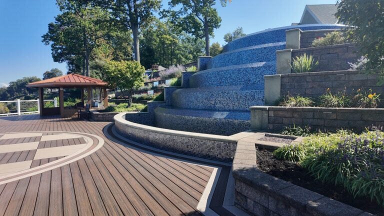 Lakefront composite deck with a checkerboard inlay and white railing on Lake Erie, built by DreamDecks near Avon, Ohio
