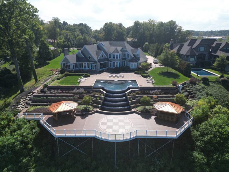 Lakefront composite deck with a checkerboard inlay and white railing on Lake Erie, built by DreamDecks near Avon, Ohio