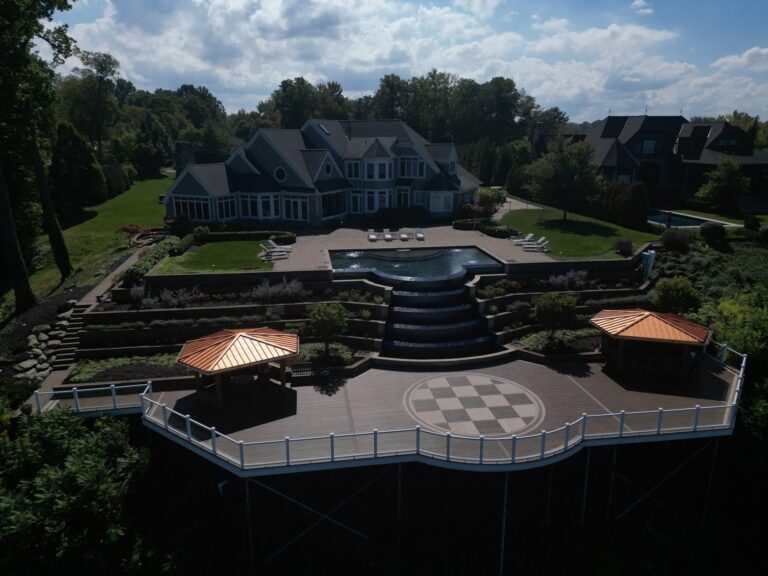 Lakefront composite deck with a checkerboard inlay and white railing on Lake Erie, built by DreamDecks near Avon, Ohio