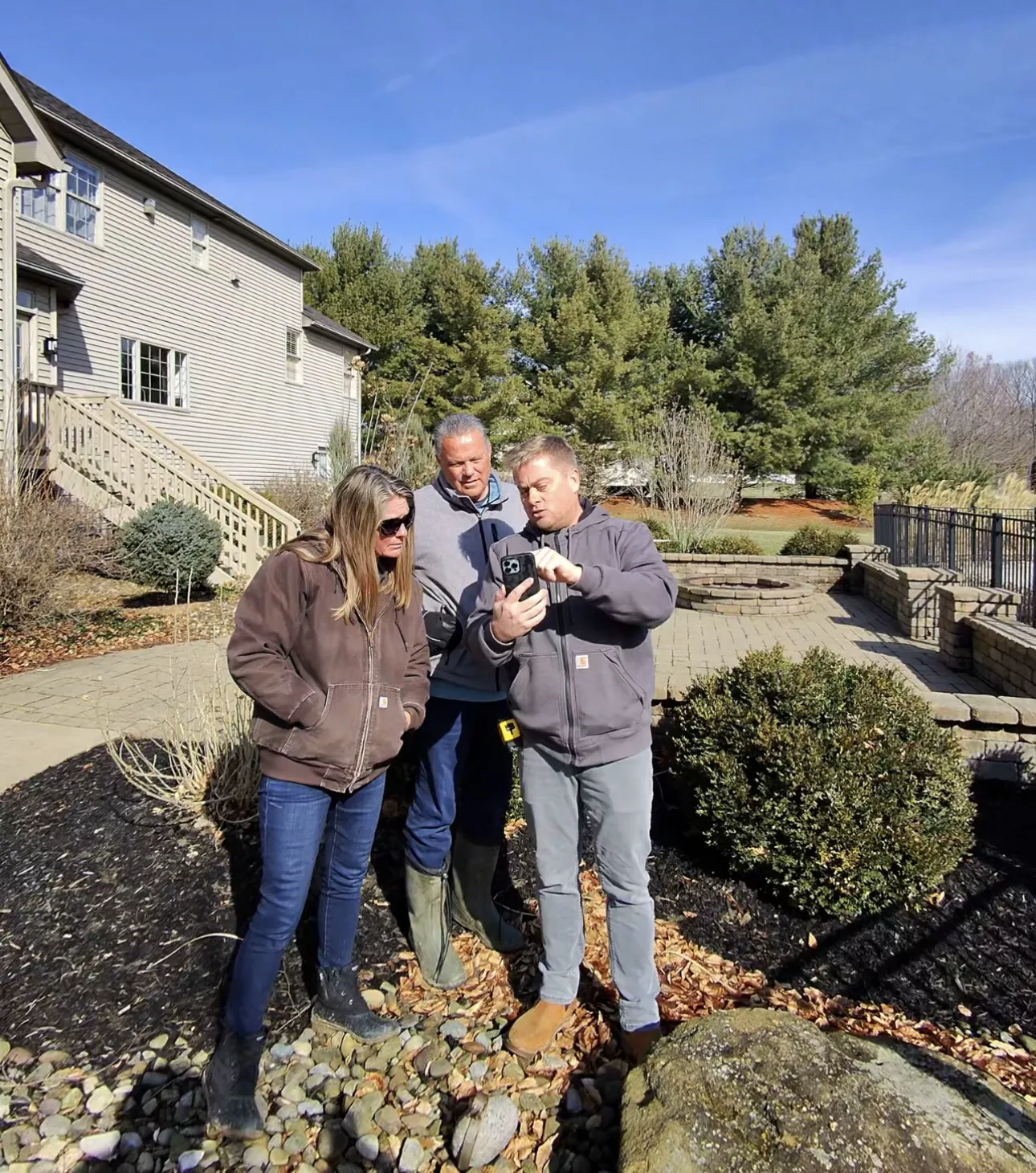 Luke walking homeowners through their deck design on site