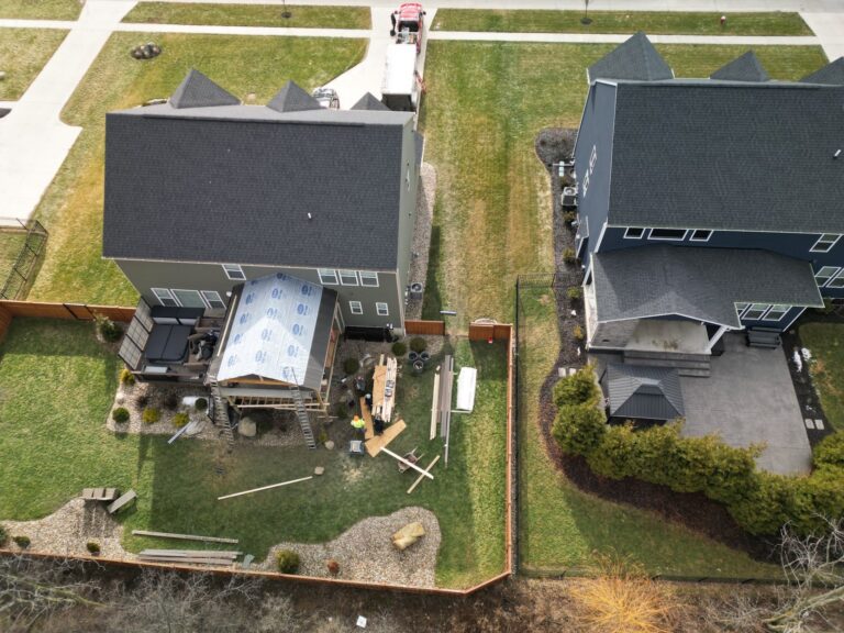 Aerial view of a covered deck roof being built by DreamDecks