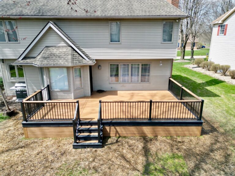 Deck with black aluminum railing and a wide drink rail, built by DreamDecks in Northeast Ohio