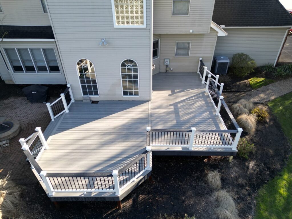 Deck with black aluminum railing and a wide drink rail, built by DreamDecks in Northeast Ohio