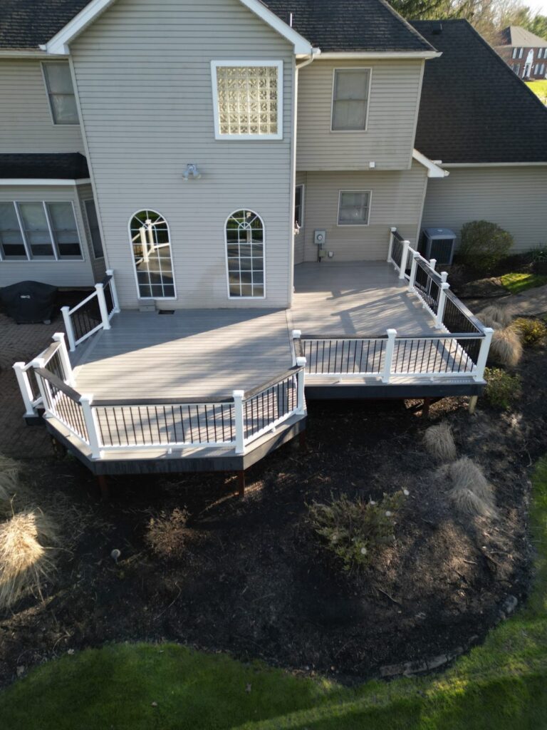 Deck with black aluminum railing and a wide drink rail, built by DreamDecks in Northeast Ohio