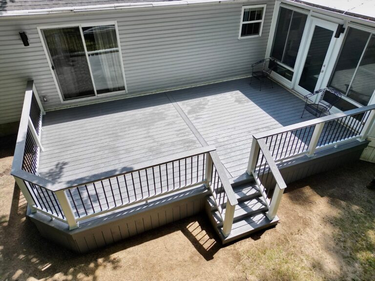 Deck with black aluminum railing and a wide drink rail, built by DreamDecks in Northeast Ohio