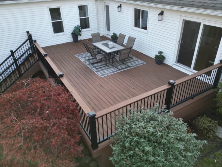 Deck with black aluminum railing and a wide drink rail, built by DreamDecks in Northeast Ohio