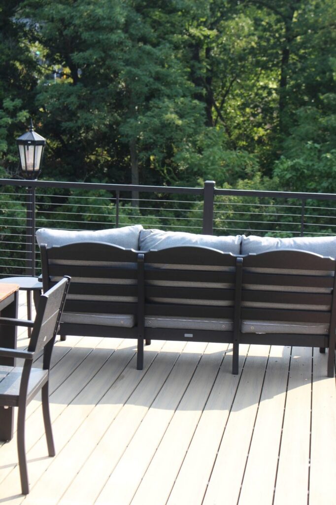 Elevated composite deck with black cable railing, built by DreamDecks in Kent, Ohio