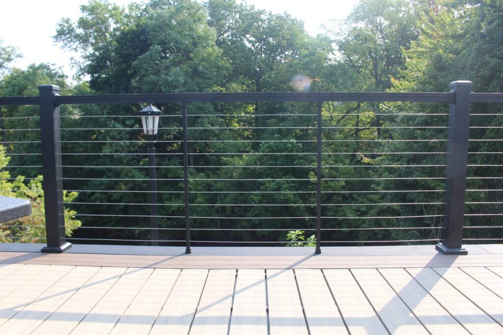Elevated composite deck with black cable railing, built by DreamDecks in Kent, Ohio