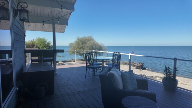 Lakefront deck with glass railing overlooking Lake Erie, built by DreamDecks in Northeast Ohio