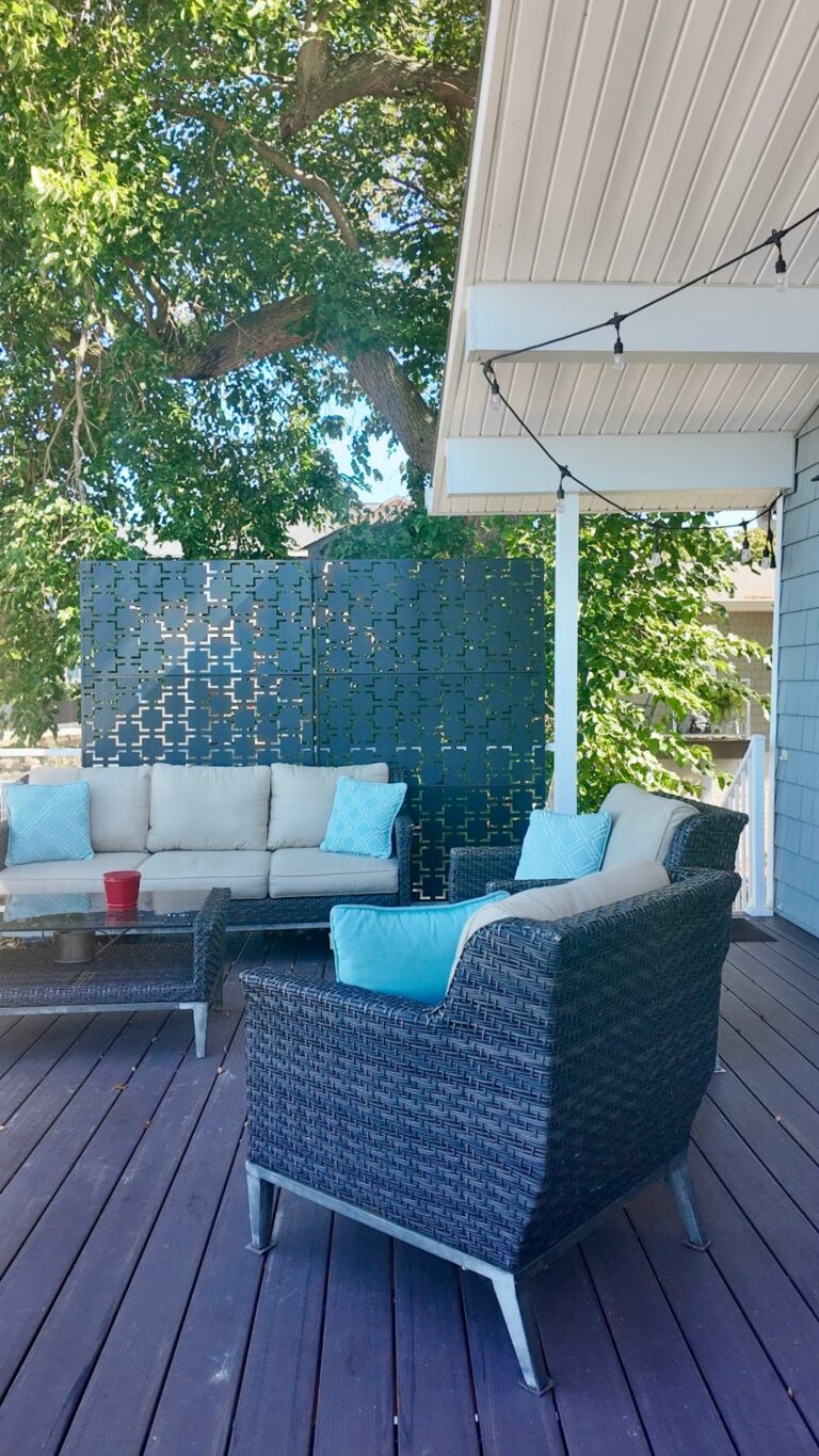 Lakefront deck lounge area with outdoor furniture, built by DreamDecks