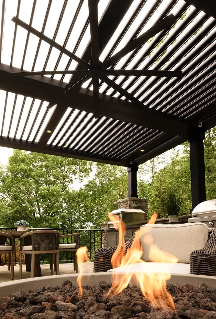 StruXure Pergola X over a seating area with a fire pit