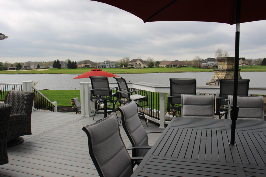 Outdoor dining with a pond view on the new Deckorators Vista deck