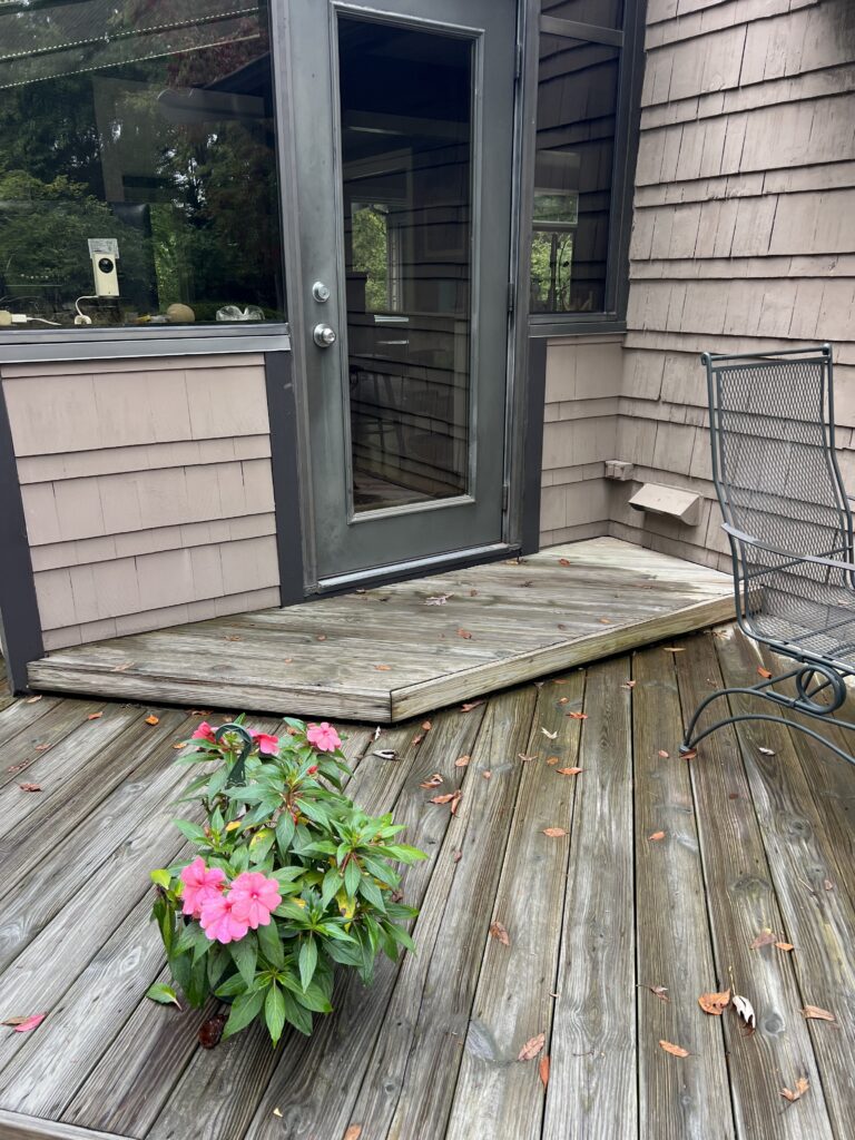 Old wood landing at the door before the resurface