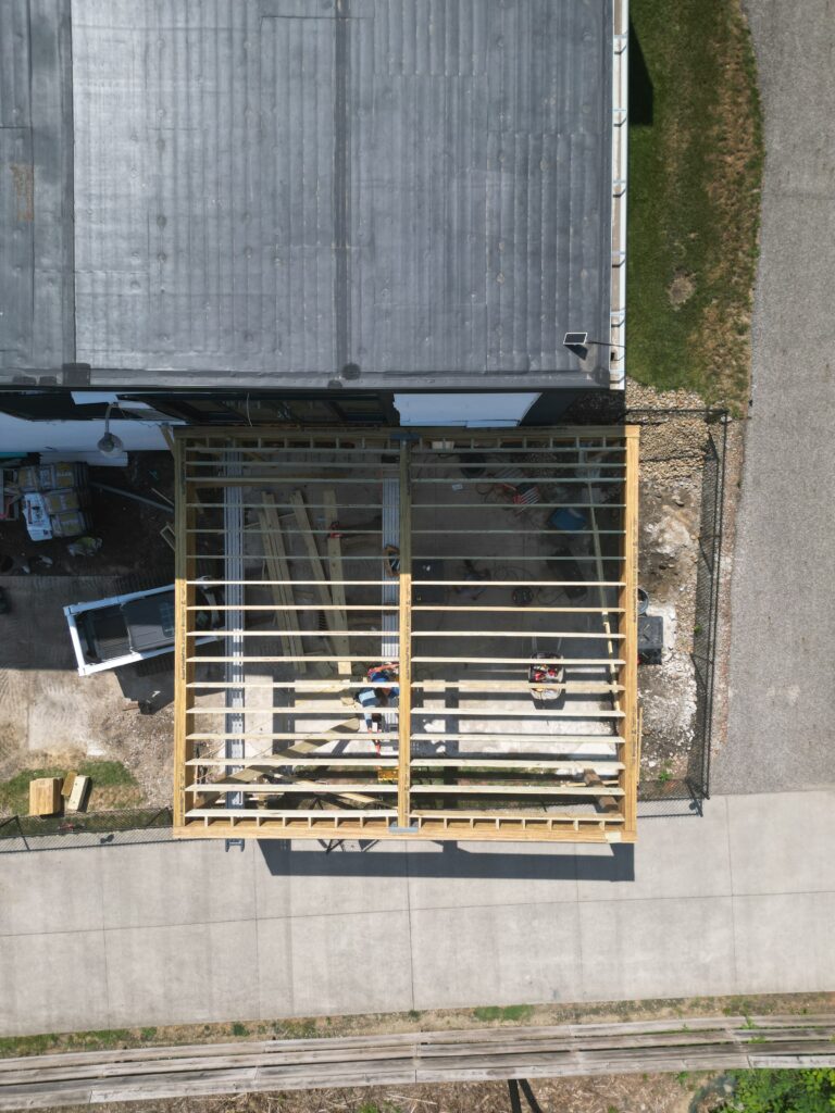 Overhead view of new deck framing spanning the driveway in Kent, Ohio