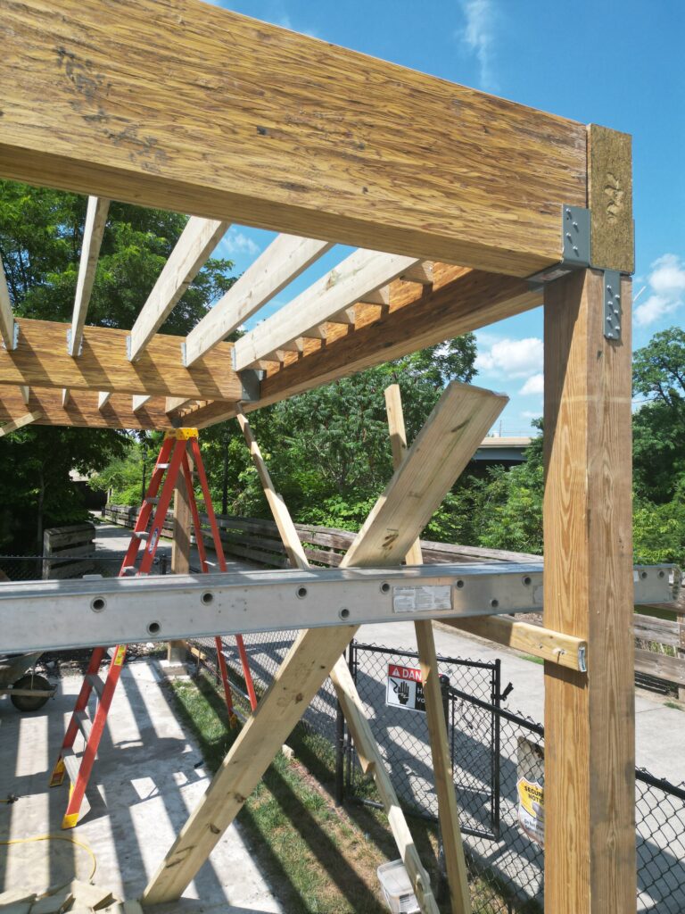 Built up beams and posts carrying an elevated deck over the 