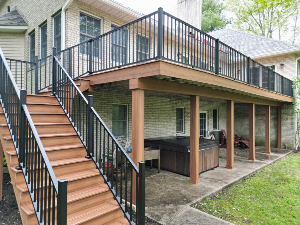 Elevated Trex Transcend Tiki Torch deck with wrapped posts and black railing in Medina, Ohio
