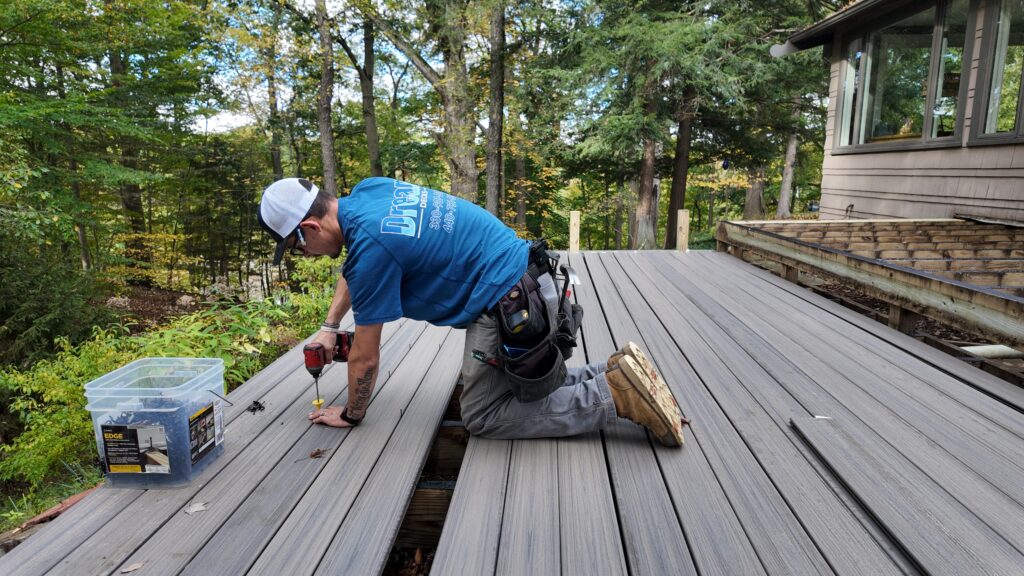 DreamDecks crew installing Trex Enhance Rocky Harbor deck bo